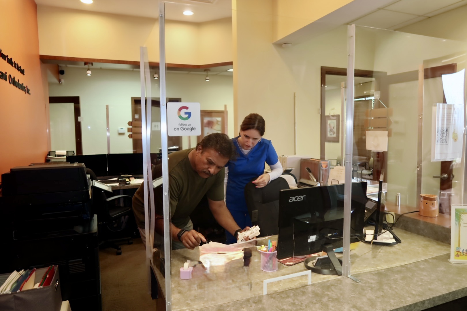 Kulkarni Orthodontics team member assisting at the front desk