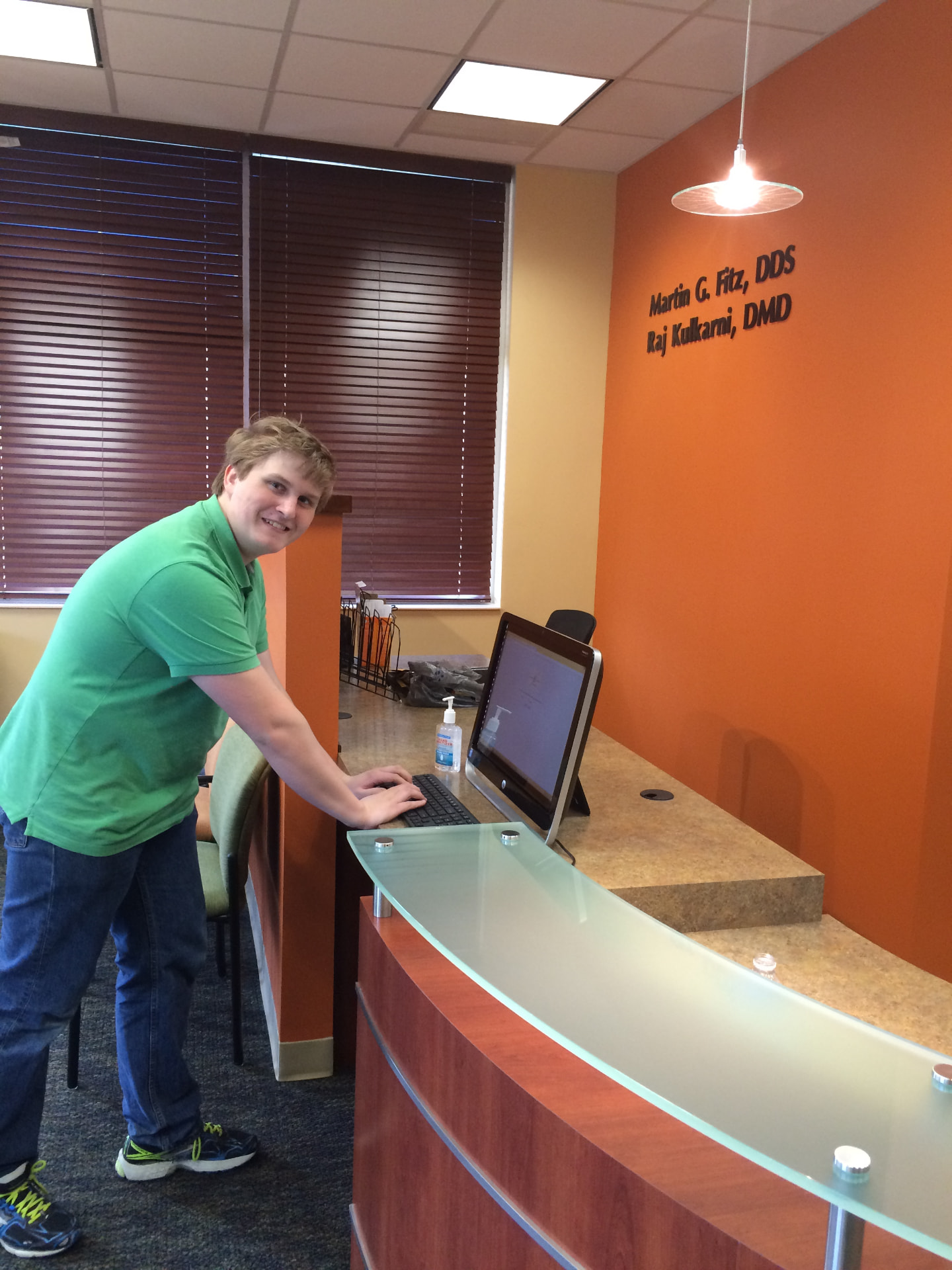 A patient checking in at the Kulkarni Orthodontics front desk